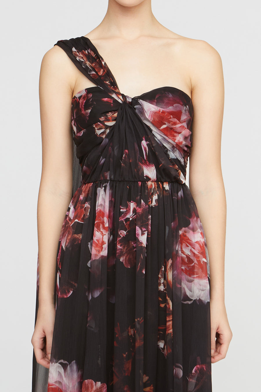 Black floral one-shoulder dress on a plain background