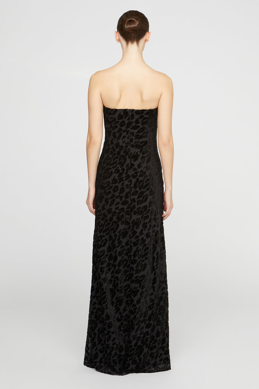 Black strapless dress with leopard print pattern on a white background
