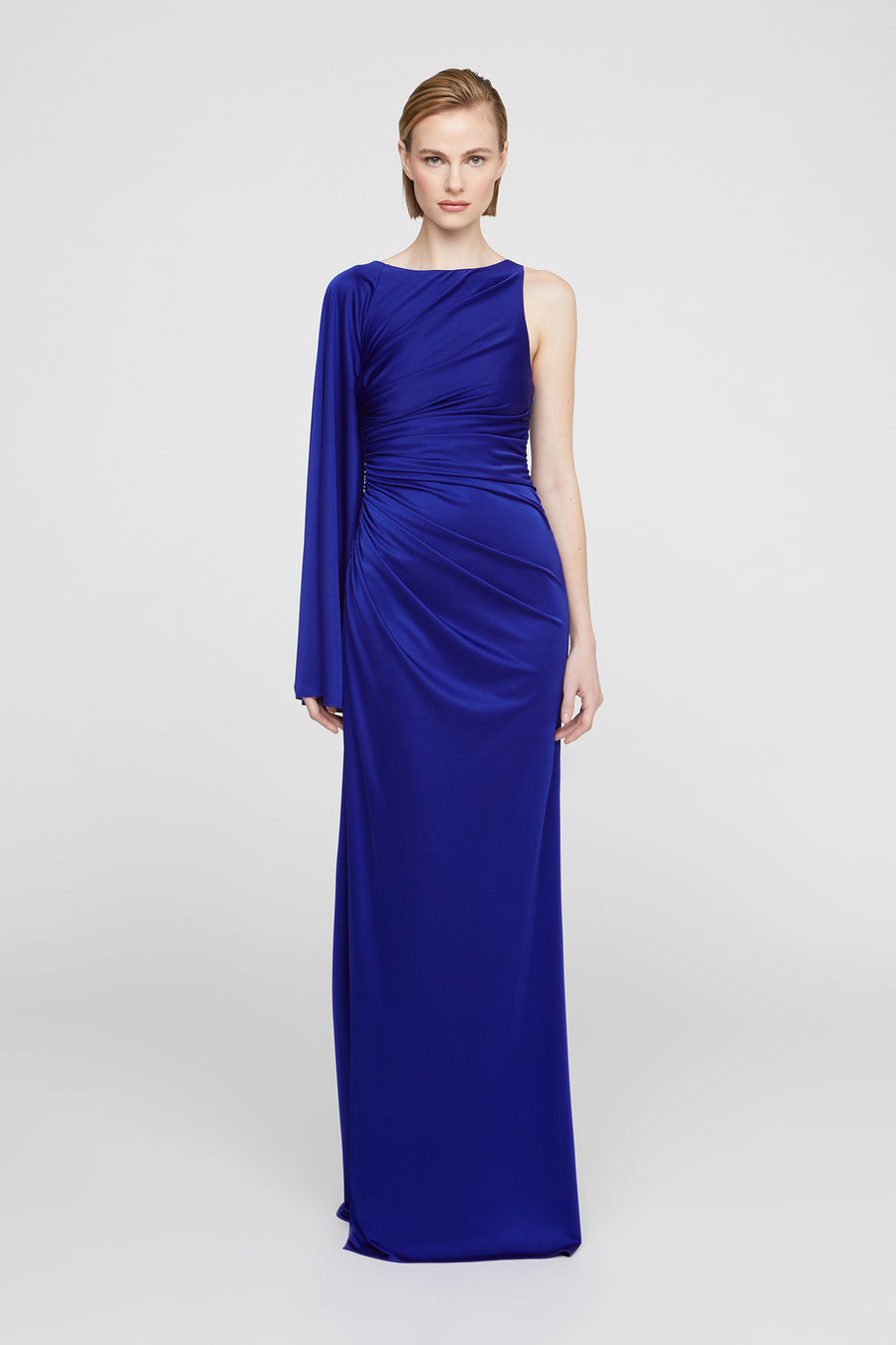 Woman wearing a blue evening gown on a white background