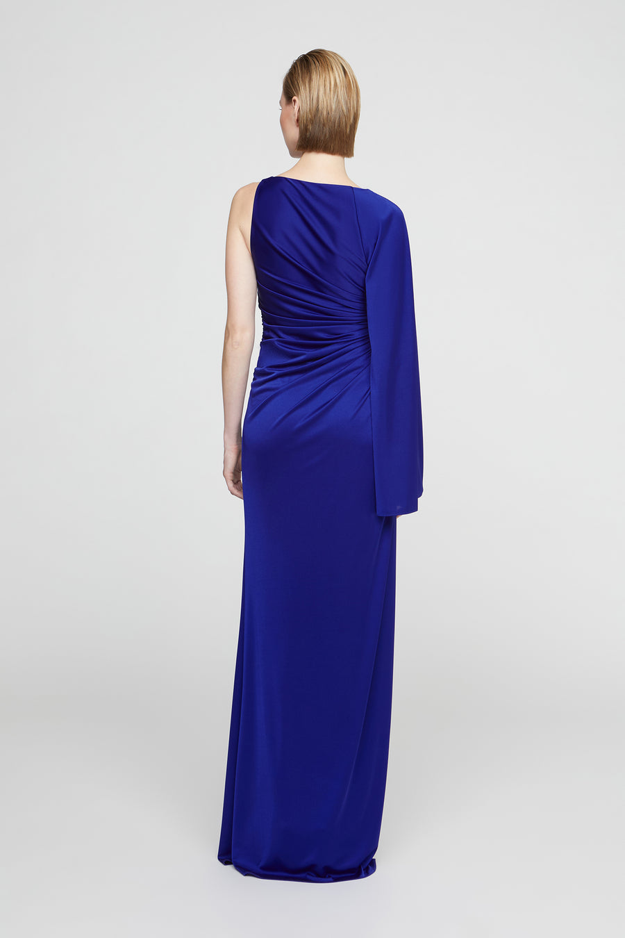 Woman wearing a blue evening gown on a white background